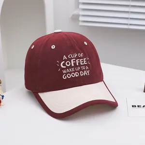 Detail of vintage red and beige cotton baseball cap with A Cup of Coffee embroidery