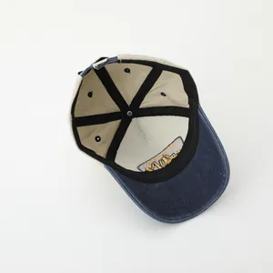 Detail view of cotton baseball cap interior showing six-panel stitch and reinforcement tape