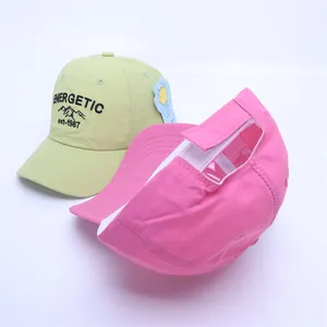 Kids quick-dry baseball caps in green and pink with energetic embroidery design