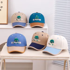 Detailed stitching of kids' baseball caps with 3D dinosaur patch and contrast colors