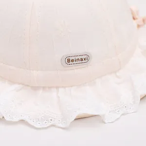 Cute beige baby sun hat with lace trim and bow for girls aged 1-3 years old