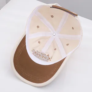 Detail of baseball cap interior showing reinforced seams and brown adjustable strap