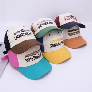 Collection of colorful cotton baseball caps with embroidered lettering in street style
