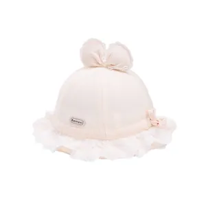 Cute baby sun hat with lace trim and bow for girls 1-3 years in soft cream white