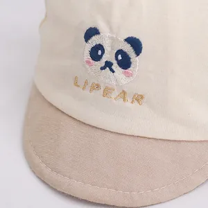 Detail of baby panda baseball cap showing fine embroidery and soft cotton texture