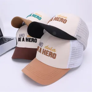 Detail of mesh trucker hats with BE A HERO embroidery and breathable mesh back panels