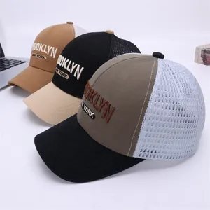 Detailed view of breathable mesh trucker hats with Brooklyn New York embroidery text