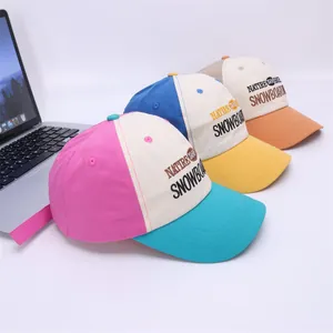 Three colorful kids baseball caps with 1986 embroidery on a clean white surface