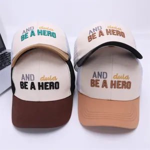 Kids contrast mesh baseball cap with embroidered BE A HERO lettering in multiple colors