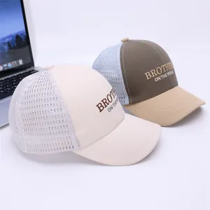 Close-up of mesh trucker hats with Brother On The Road embroidery and breathable netting