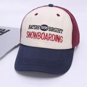 Detail of color-block baseball cap featuring premium embroidery and tricolor panels