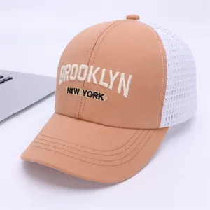 Kids breathable mesh trucker hat with Brooklyn embroidery in khaki and white