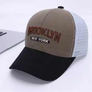 Detail of Brooklyn and New York embroidery on a breathable mesh trucker cap for kids
