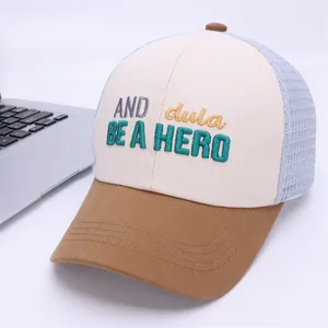 Detailed close-up of kids mesh baseball cap with BE A HERO embroidery and tricolor panels