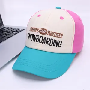 Detail of multi-color embroidered kids baseball cap with vibrant contrast panels