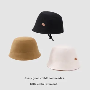 Kids cotton bucket hats with cloud patches in black, tan and beige for summer sun protection