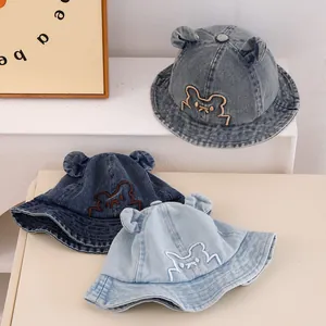Cute bear-eared denim bucket hats for toddlers in three shades of soft washed blue