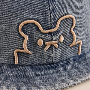 Classic blue denim kids bucket hat with cute cartoon bear embroidery detail