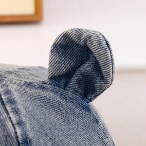 Detail shot of 3D bear ears on a vintage wash blue denim bucket hat for toddlers
