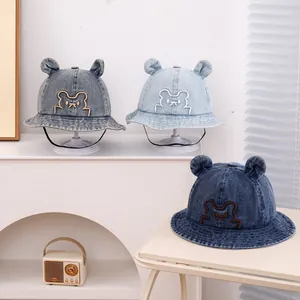 Three shades of denim baby bucket hats with cute bear ears and windproof strap detail