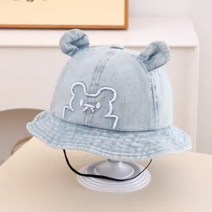 Close-up of baby denim sun hat featuring cute bear ears and detailed embroidery