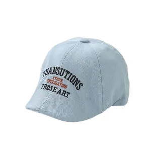 Breathable light blue cotton beret for boys with stylish embroidery on white background