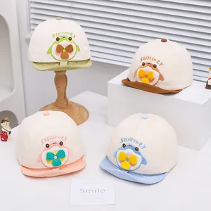 Detail of four colorful breathable cotton baby baseball caps with cute 3D animal patterns
