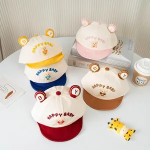Collection of baby baseball caps with bear ears and Happy Baby embroidery in five colors