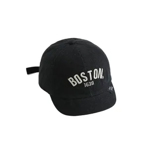 Kids black denim baseball cap with BOSTON embroidery and a short brim style