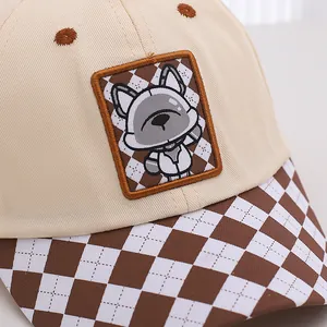 Beige kids baseball cap with cute cartoon dog patch and brown checkered brim design