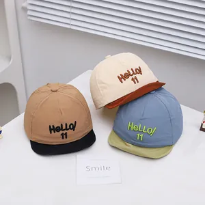 Three colorful baby baseball caps with HELLO 11 embroidery and stylish contrasting brims