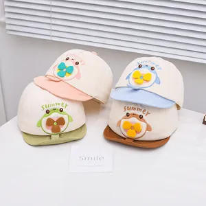 Detailed view of baby summer baseball caps with cartoon animals and yellow fan propellers