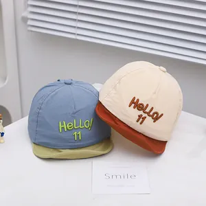 Cute baby baseball cap with HELLO 11 embroidery in blue and beige color options