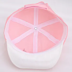Detail of pink toddler baseball cap interior with breathable mesh lining and reinforced seams