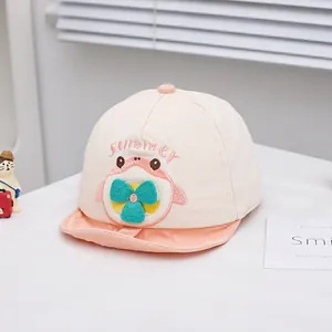 Close-up of summer baby baseball cap with cute cartoon embroidery and soft pink brim