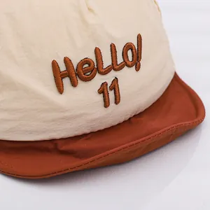 Infant baseball cap with Hello 11 embroidery and stylish color-block design