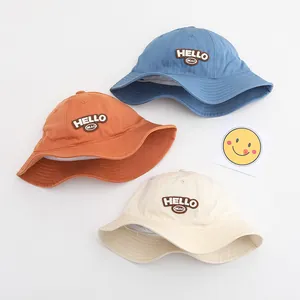 Detailed close-up of HELLO letters embroidery on cotton toddler sun bucket hats