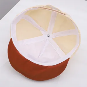 Detail of baby baseball cap interior showing white sweatband and adjustable back strap