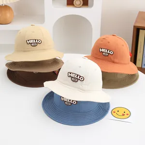 Various colors of cotton bucket hats for toddler girls with HELLO embroidered patch detail