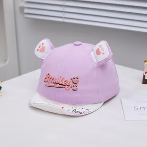 Detail of purple cotton baby baseball cap with smiley embroidery and animal ear accents