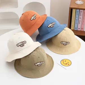 Detail view of cotton sun hats for toddlers featuring HELLO BEAO leather patch embroidery