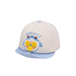 Baby baseball cap with shark embroidery and a decorative propeller on white background