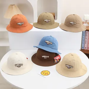 Selection of kids cotton bucket hats with HELLO embroidery in seven assorted colors