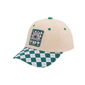 Kids baseball cap featuring beige crown, green checkerboard brim and cartoon dog patch