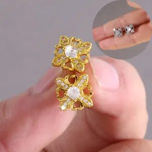 Macro shot of butterfly earrings with copper micro-set zircon in gold and silver finish