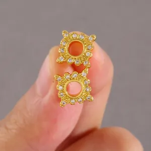 Macro shot of gold square geometric earrings featuring micro-paved cubic zirconia