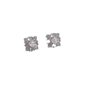 Sparkling silver flower earrings with clover and cross design and round cubic zirconia center
