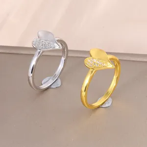 Minimalist heart ring with micro-paved cubic zirconia in gold and silver finishes
