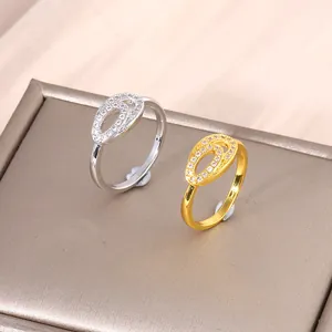 Anelli doppi ovali in rame con zirconi micro-pavé in finitura oro e argento
