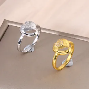 Double heart ring in gold and silver finish with pave-set cubic zirconia accents